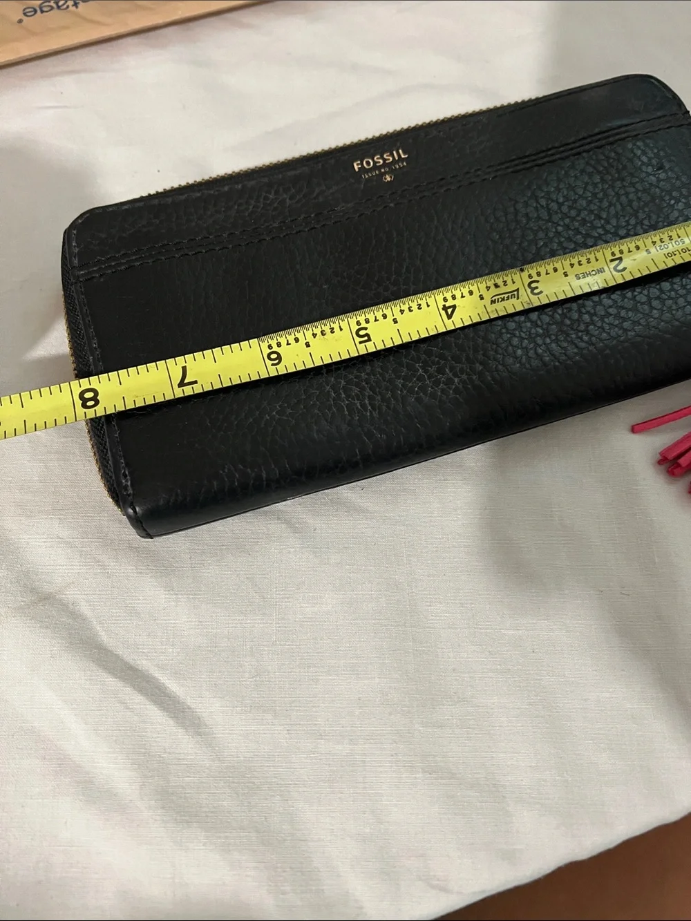 Fossil Black Leather Wristlet Wallet with Pink Tassel Charm